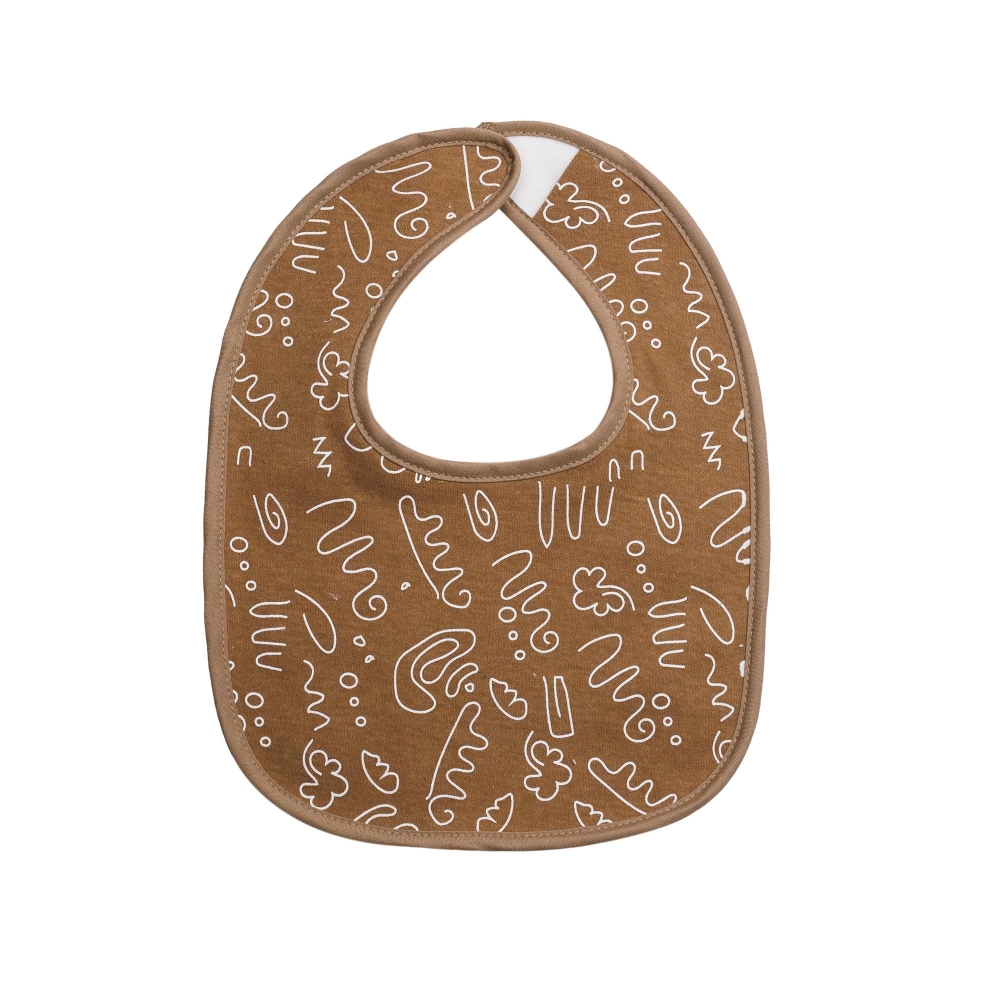 zoom sur le bavoir camel avec ses motifs zoom sur le bavoir camel avec ses motifs