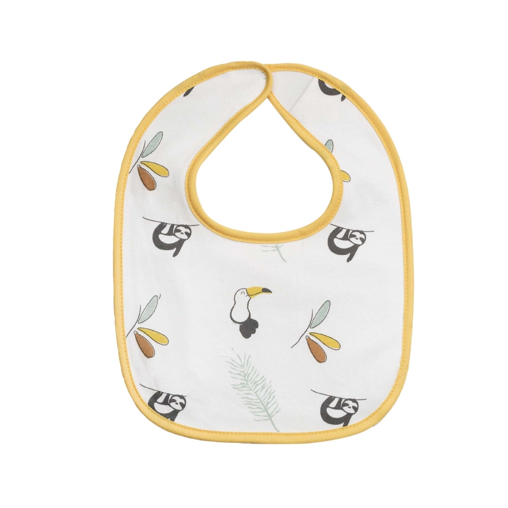 Close-up of the white and mustard bib with sloths and pelicans Close-up of the white and mustard bib with sloths and pelicans