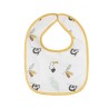 Close-up of the white and mustard bib with sloths and pelicans Close-up of the white and mustard bib with sloths and pelicans