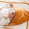 Baby who fell asleep in their hooded bath towel