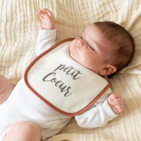 Set of 6 white bibs with small messages