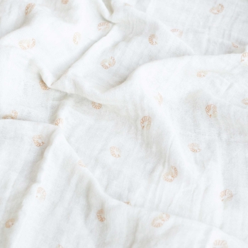 Off-white swaddle with terracotta leaf patterns