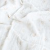 Ecru swaddle with terracotta leaf patterns Ecru swaddle with terracotta leaf patterns