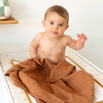 Baby in their terracotta swaddle