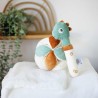 Brinquedo de apertar em forma de dinossauro com bola sensorial