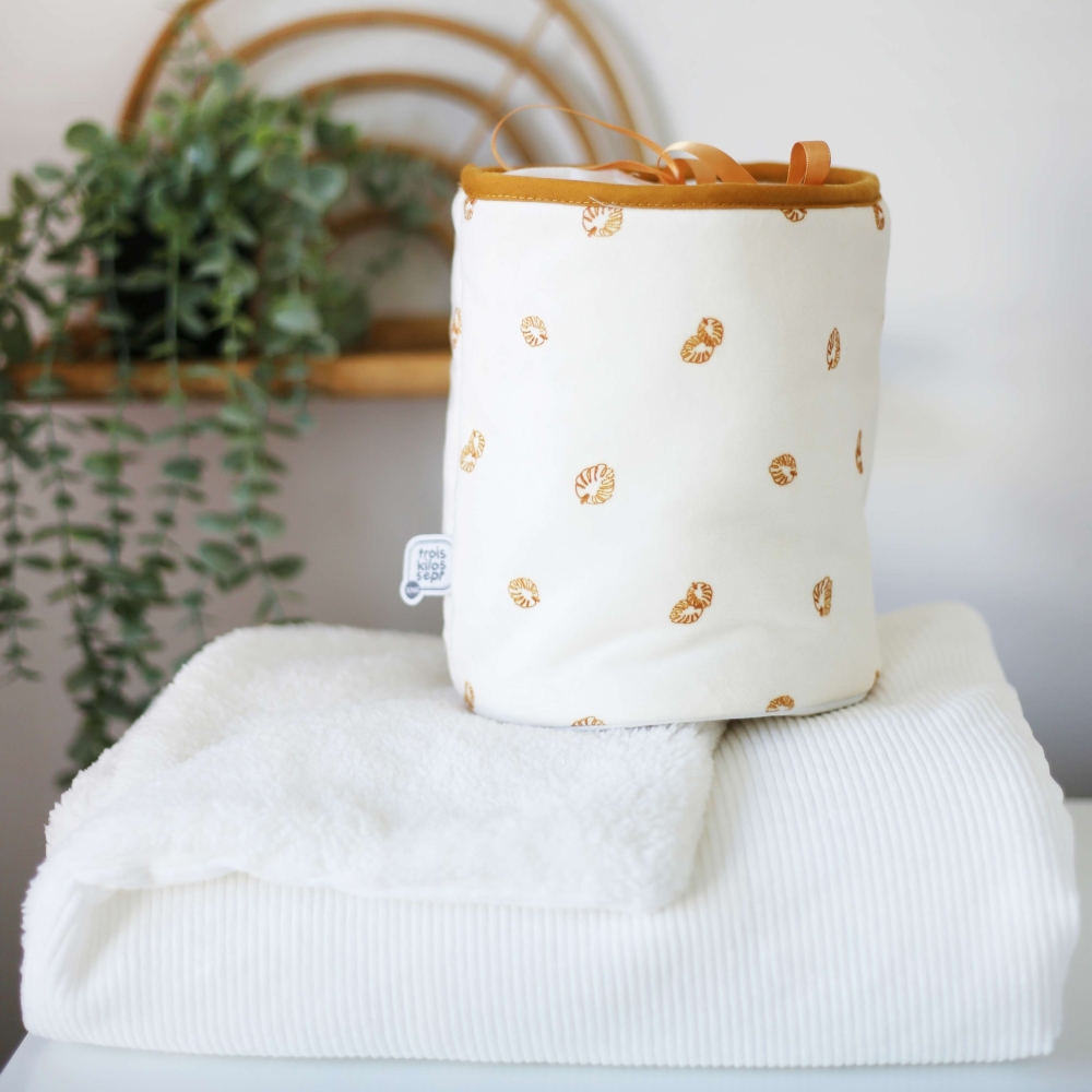 Storage basket on the changing table Storage basket on the changing table