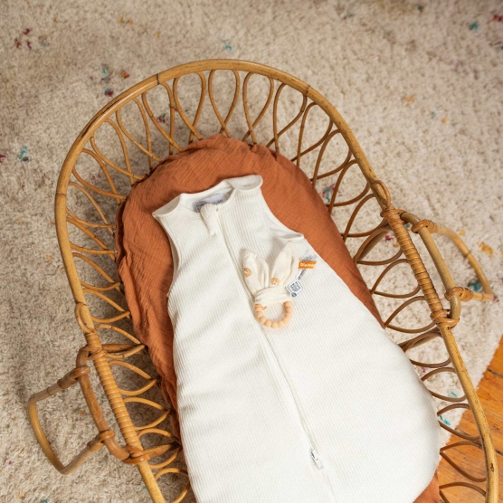 Front view of newborn sleeping bag, white corduroy
