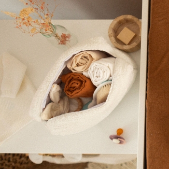 Open baby toiletry bag with baby essentials.