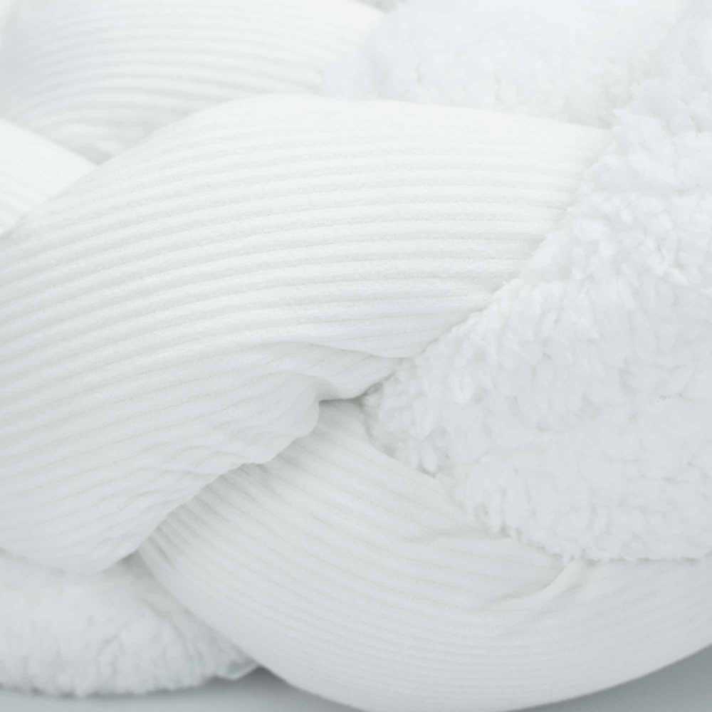 Zoom on decorative braid material in ecru