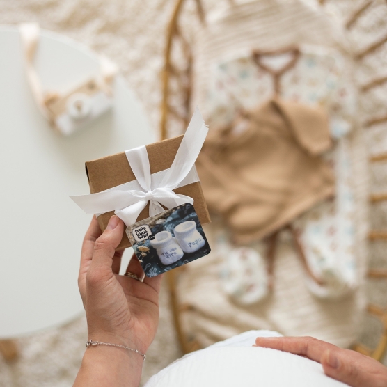 Newborn booties with "you're going to be a dad" embroidery