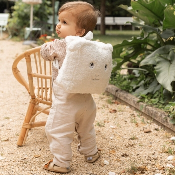 baby walking with sheep backpack
