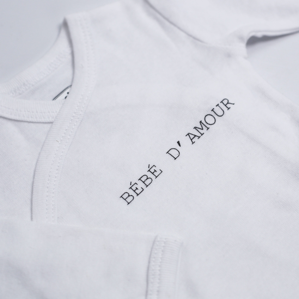 zoom opschrift op wit rompertje voor baby