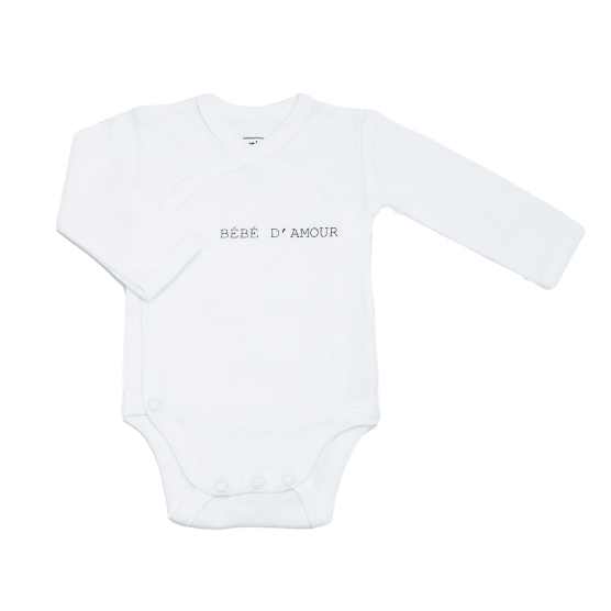 White baby bodysuit with "love baby" inscription