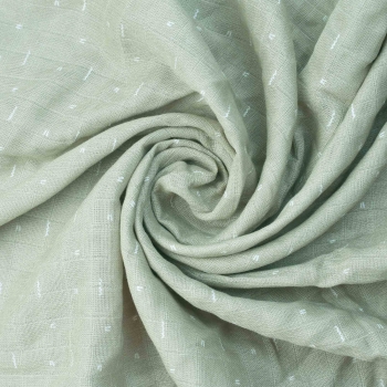 green baby swaddle with white pattern