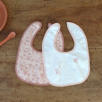 pink bib and white bib sold by 6