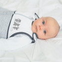 baby boy with blue eyes lying in his bed with his mixed birth sleeping bag baby boy with blue eyes lying in his bed with his mixed birth sleeping bag