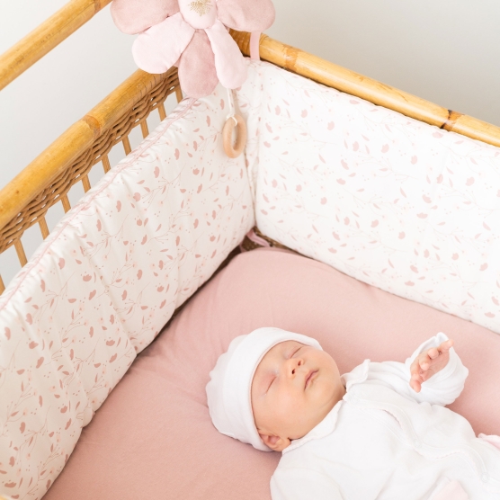 Small cotton bed bumper with floral pattern