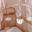 musical mobile above a sleeping baby in his crib