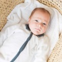 Baby in white and blue polo collar pajamas Baby in white and blue polo collar pajamas