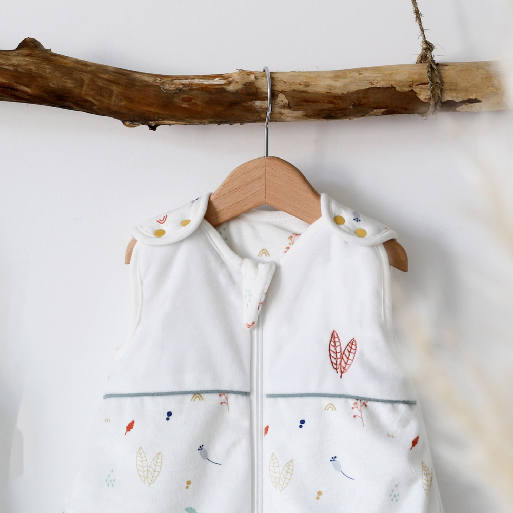 Birth sleeping bag hanging with a hanger on a wooden shelf Birth sleeping bag hanging with a hanger on a wooden shelf