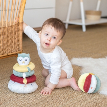 Baby playing with his sensory ball and stacking tower.
