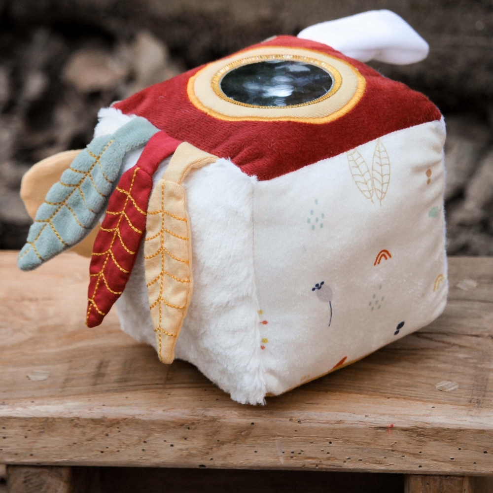 baby awakening toy on its wooden stool