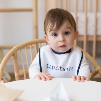 Baby boy with captain bib