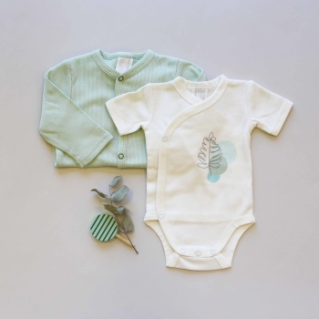 Staging of the ecru bodysuit with a sage corduroy pajama