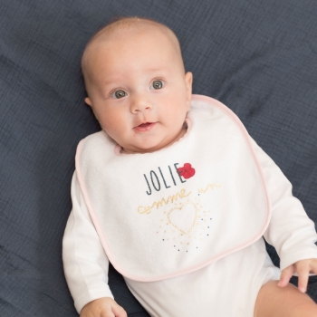Little girl and her pink and blue bib