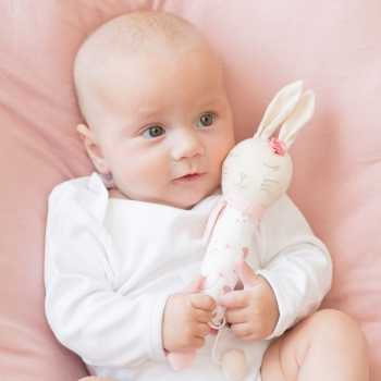 Little girl having fun with her Lili the rabbit musical stick