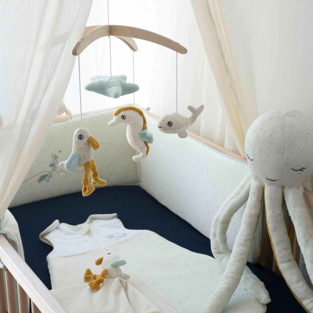 preparing baby's bed with comfort toy preparing baby's bed with comfort toy