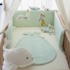 whale plush toy in a baby crib with bed linen whale plush toy in a baby crib with bed linen