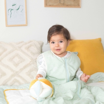 baby playing with a fabric ball