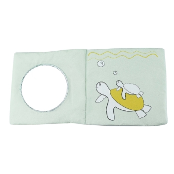 baby book with mirror and turtle