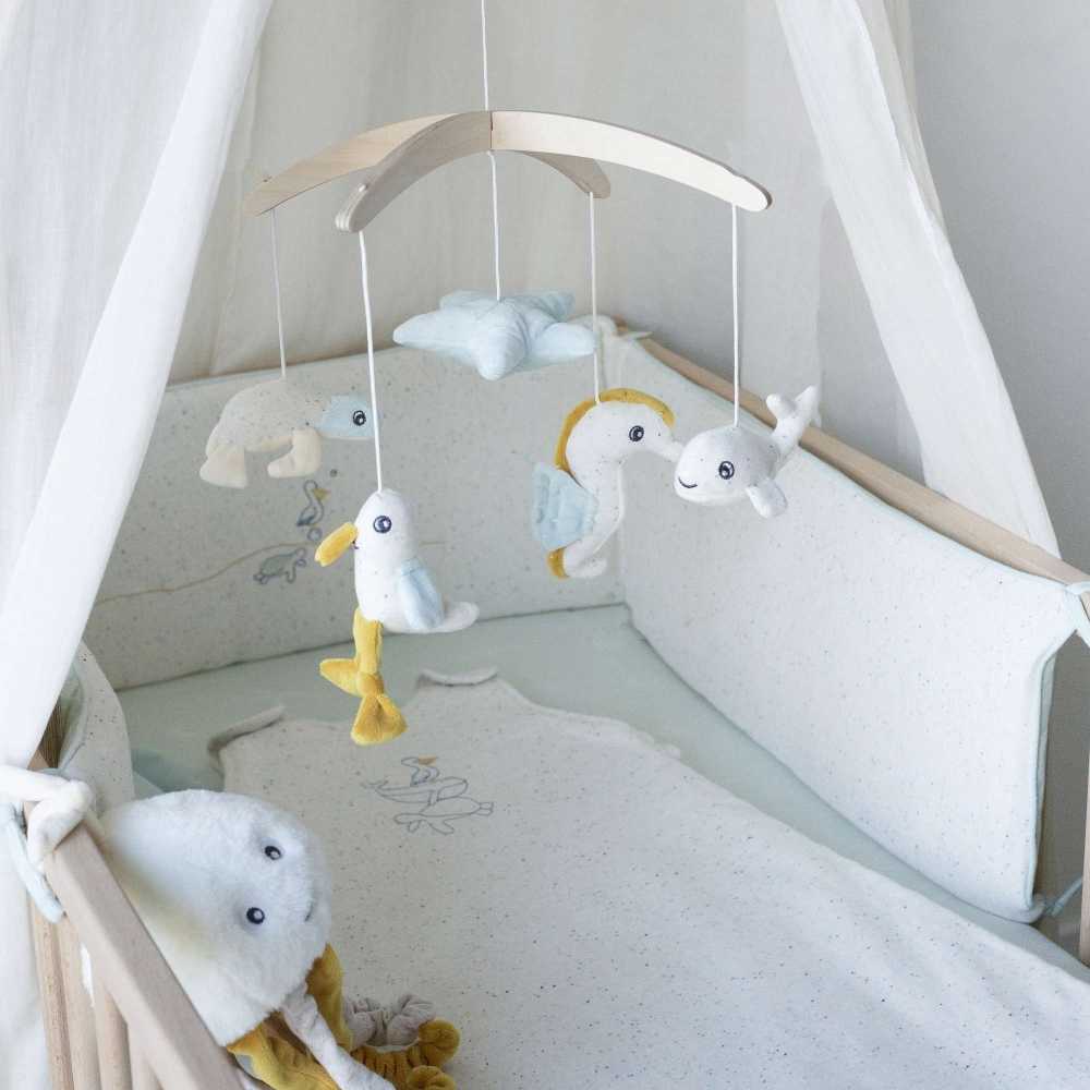peluche musical Ao largo de Nova na cama