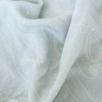 Close-up of the light green swaddle pattern