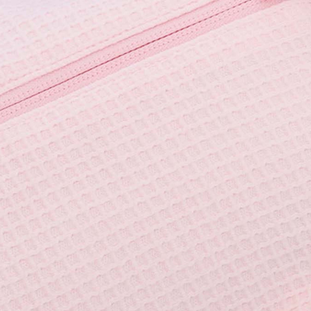 close-up of pink pure cotton waffle fabric close-up of pink pure cotton waffle fabric