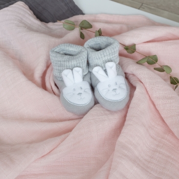 staging of grey little rabbit newborn booties