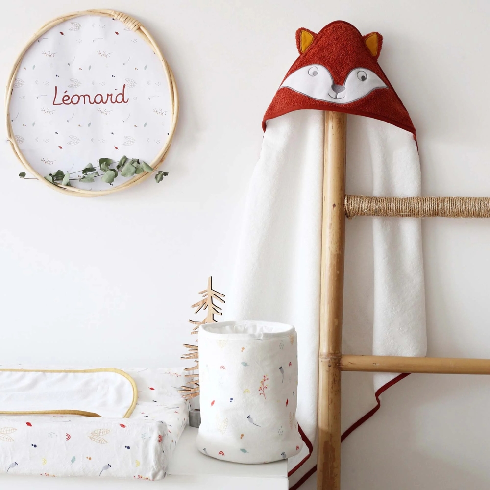 terracotta bath towel on a decorative wooden ladder. terracotta bath towel on a decorative wooden ladder.