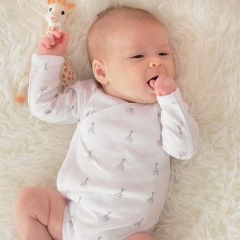Baby in Sophie the Giraffe wrap-around bodysuit