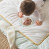 Baby looking at themselves in the play mat mirror Baby looking at themselves in the play mat mirror