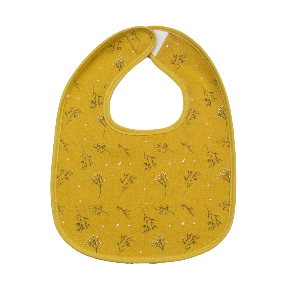 Magnifique bavoir moutarde avec all-over fleuri Magnifique bavoir moutarde avec all-over fleuri