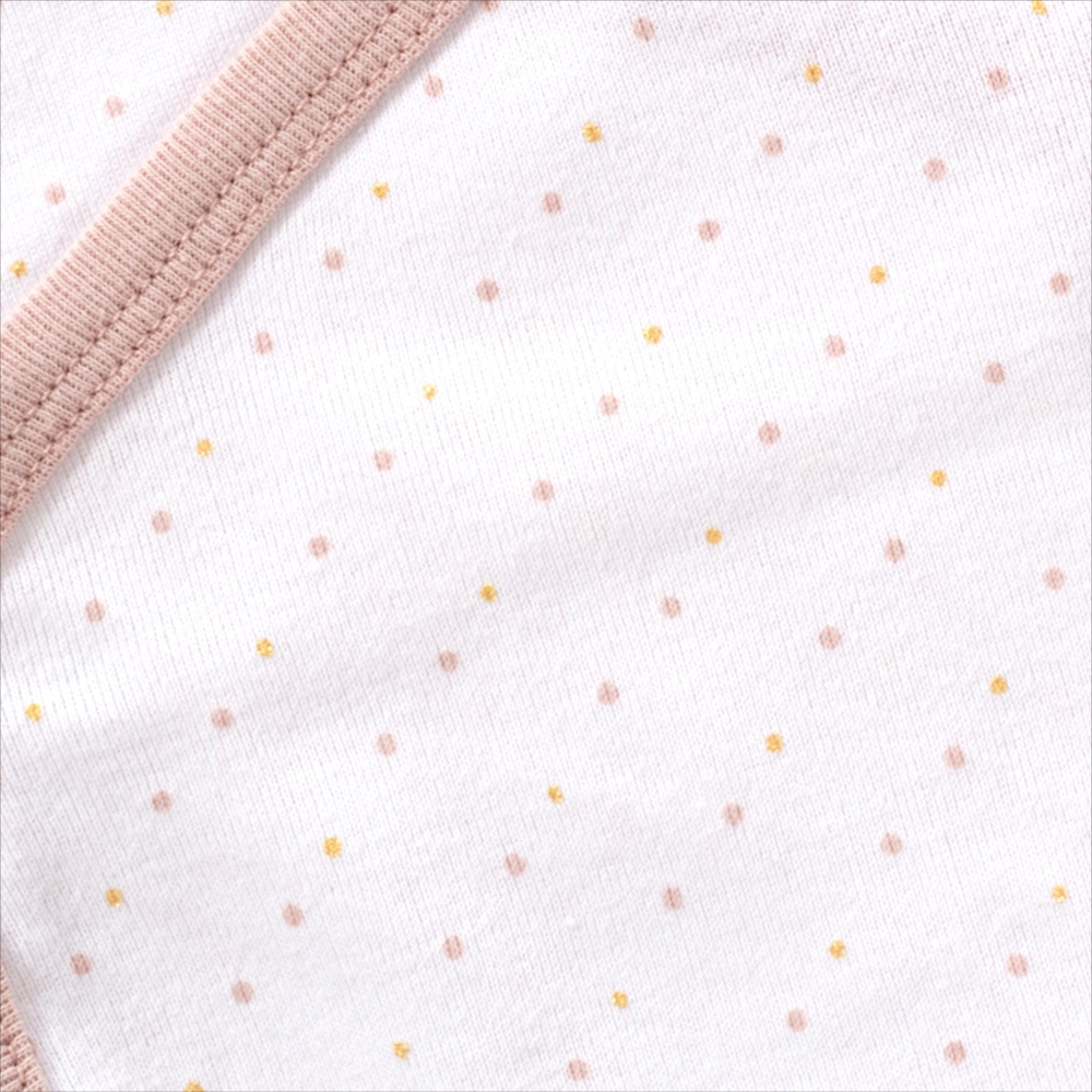 Detail of the colored polka dot print on the "Mistinguette" baby girl bodysuit Detail of the colored polka dot print on the "Mistinguette" baby girl bodysuit